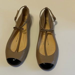 Giuseppe Zanotti Design. Tan with black toe tip.  Ankle Strap Flats.